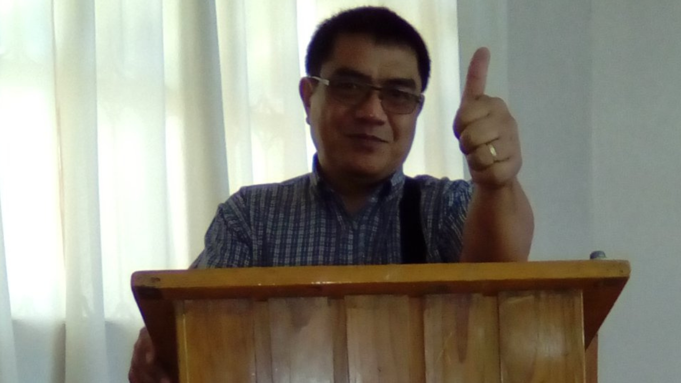 A pastor preaching in pulpit