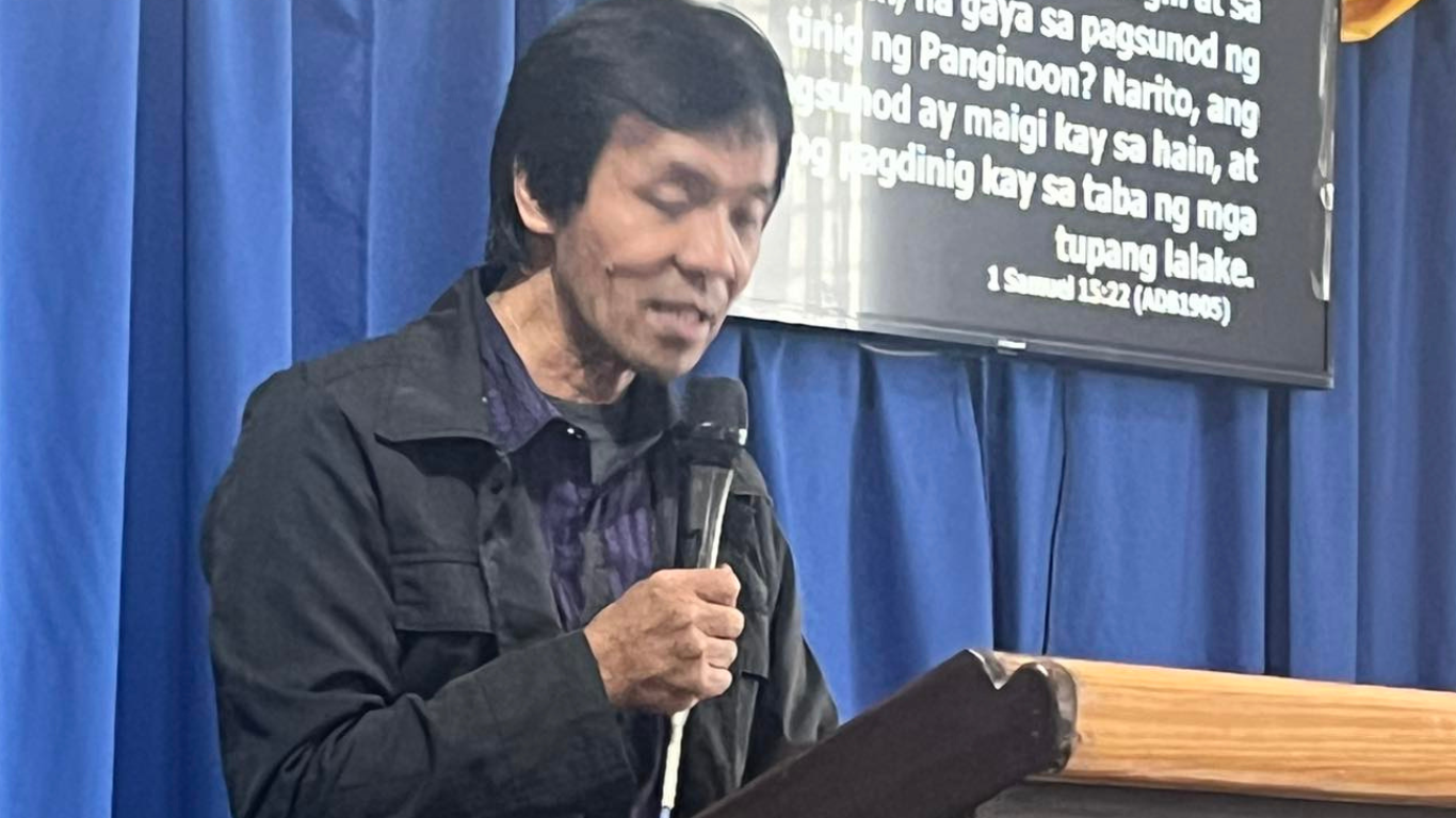 A pastor preaching in pulpit